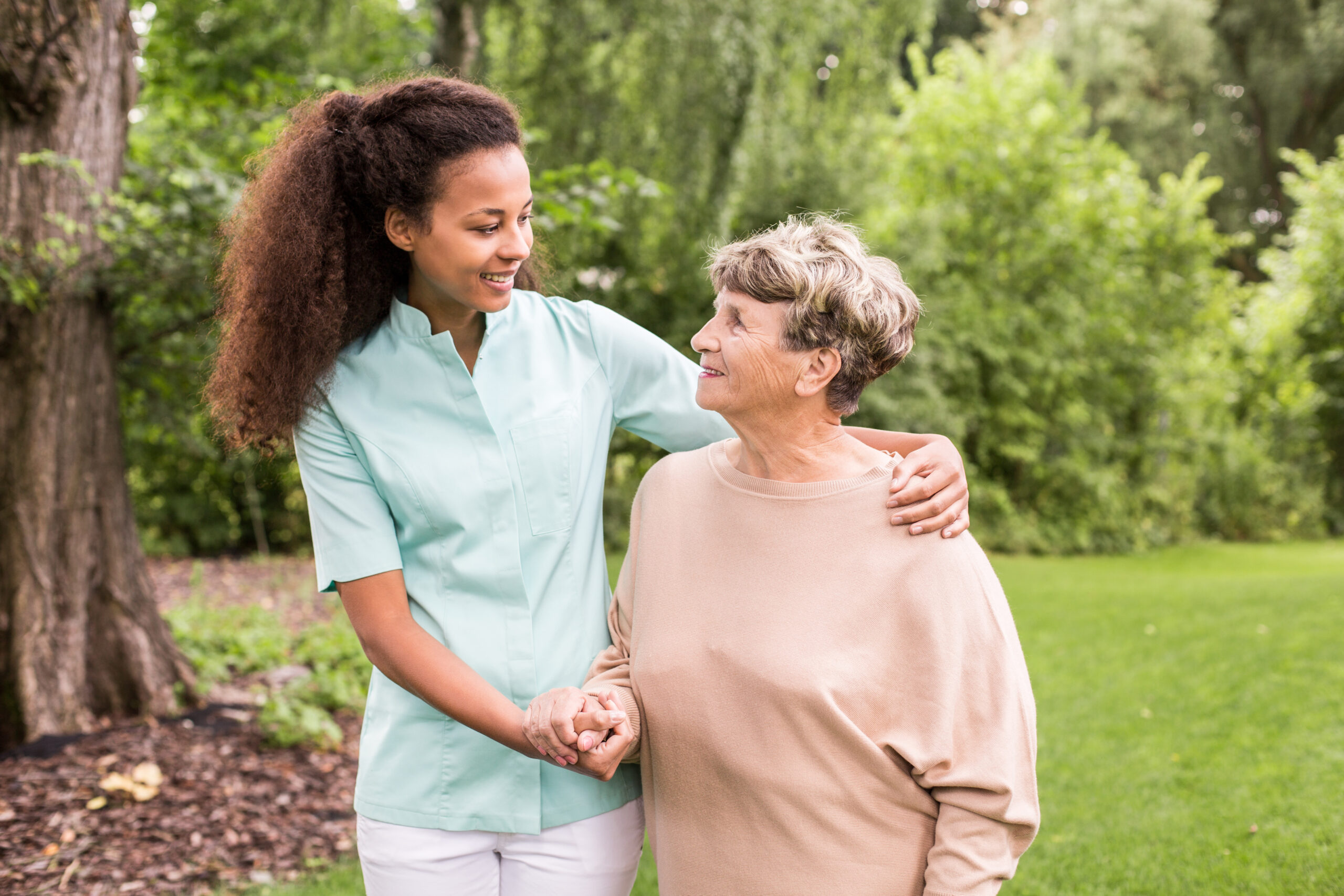 Nurse is walking around with elder lady